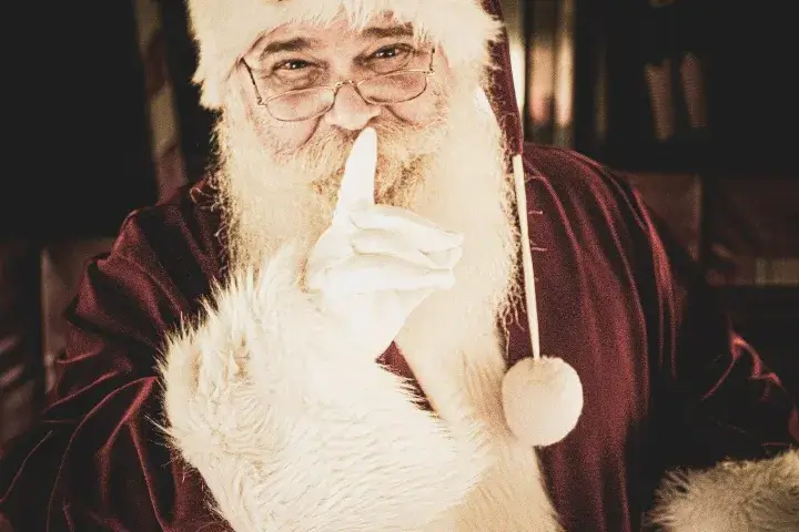 santa shushing someone