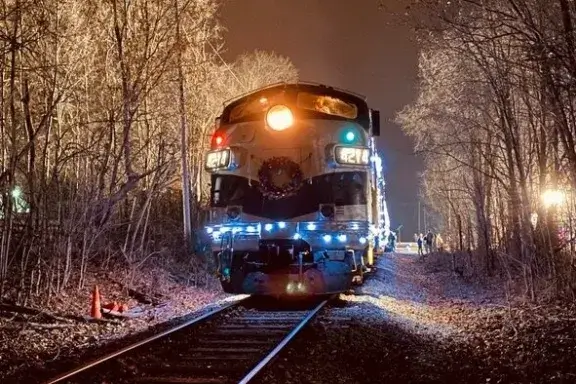 train on railroad tracks during the night