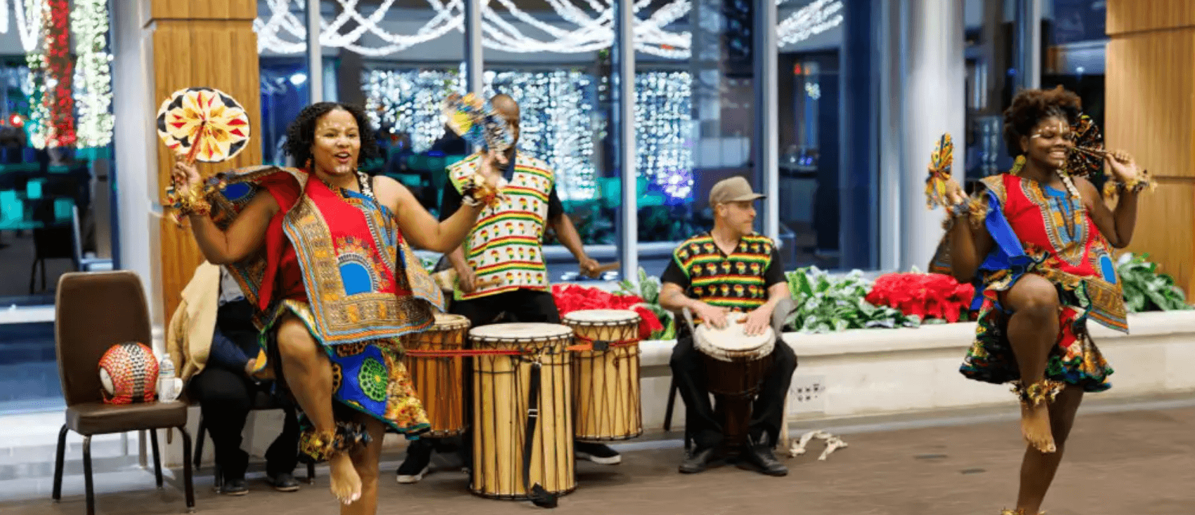kwanzaa celebration with outfits, music, and dance