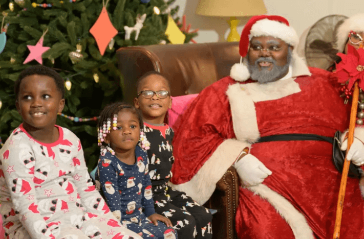 santa with children in pajamas