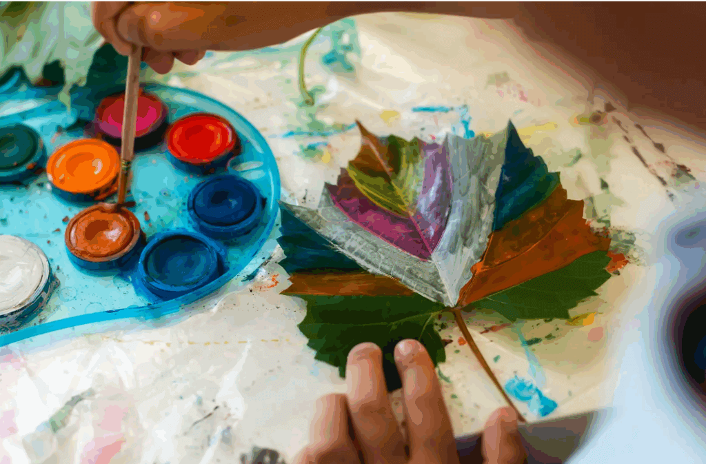 a leaf being painted with a brush
